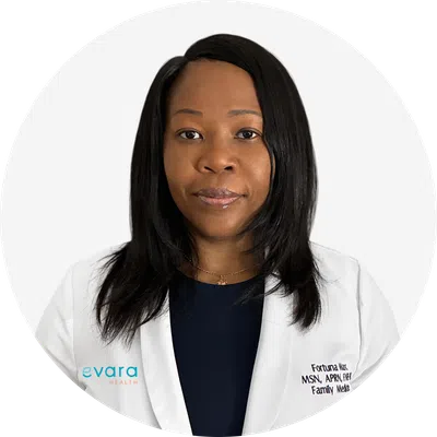 Professional female healthcare provider in white coat with Evara Health logo on plain background