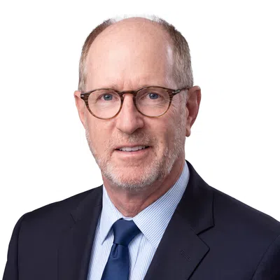 Professional man with a navy blue blaser and glasses