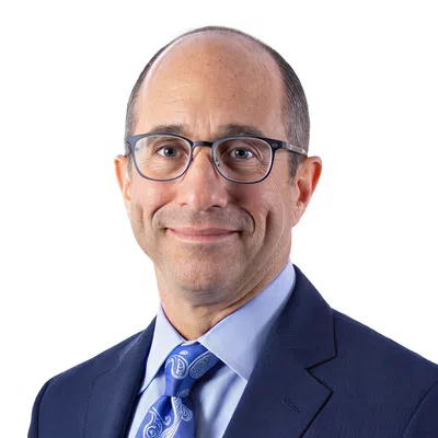 Professional man with a blue blaser and glasses