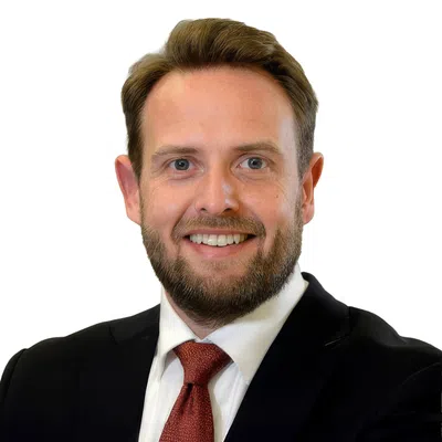 Professional man with a blue blaser and red tie