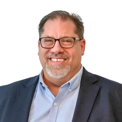 Professional man with a gray blaser and glasses