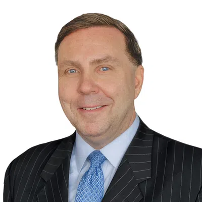 Professional man with a black blaser and blue tie