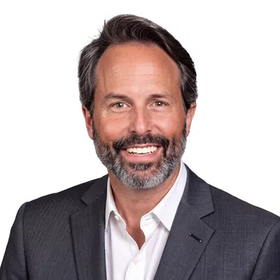 Professional man with a gray blaser and white shirt
