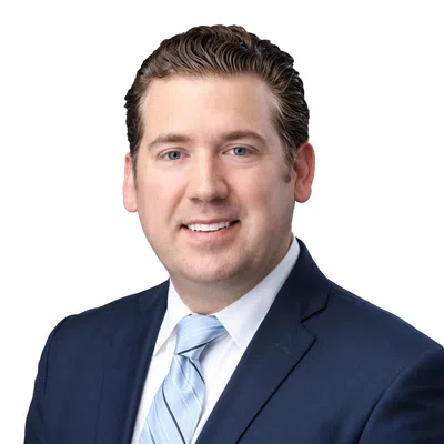 Professional man with a blue blaser and blue tie