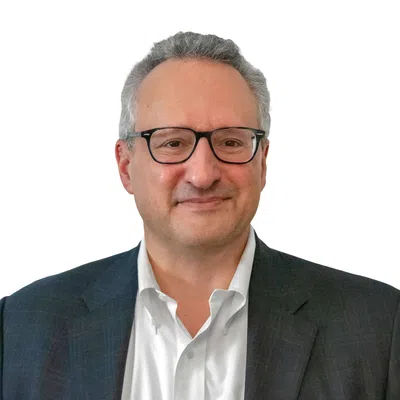 Professional man with a gray blaser and glasses