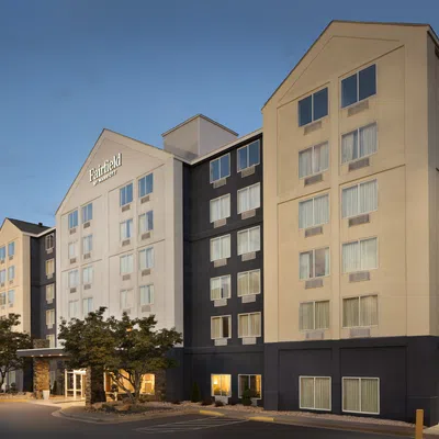 Exterior view of Fairfield Inn & Suites hotel building with multiple floors during early evening light