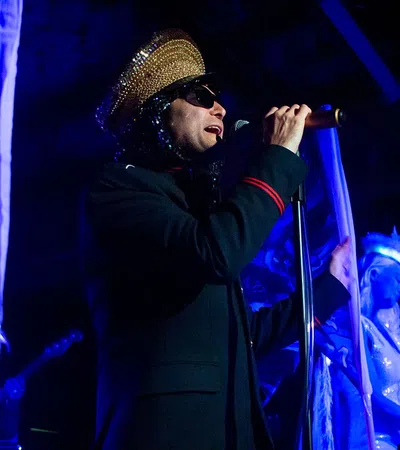 a man singing into a microphone