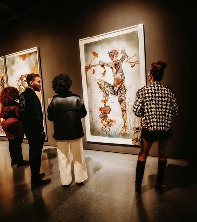 a group of people looking at art