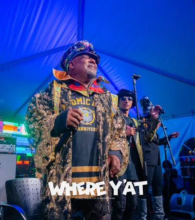 a man wearing a camouflage uniform and holding a microphone