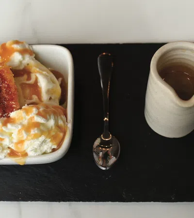 a plate of food and a cup of coffee