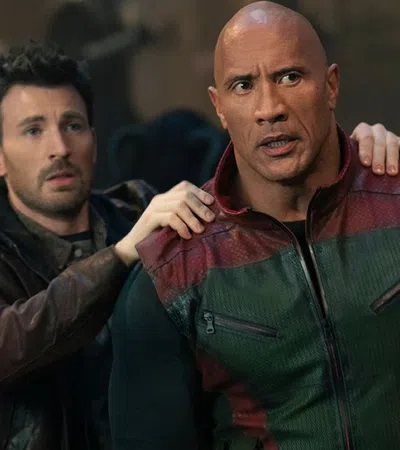 Dwayne Johnson, Chris Evans are posing for a picture