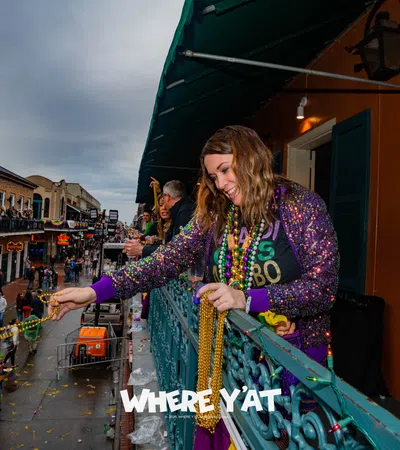 a person holding a large colorful snake