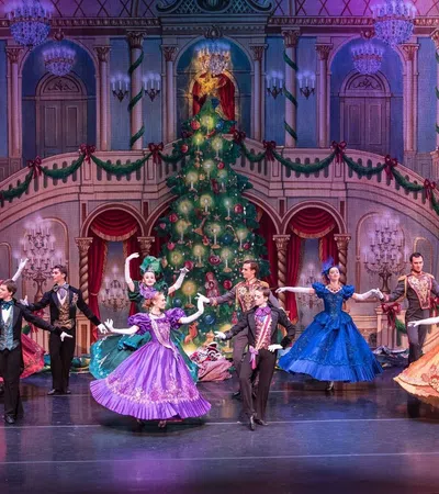a group of people dancing on a stage