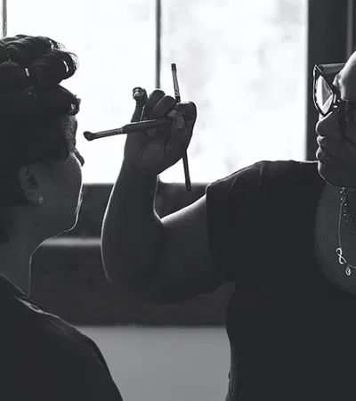 a woman with a mask on her face and a man with a gun