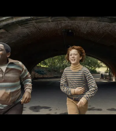 a man and woman standing in a tunnel