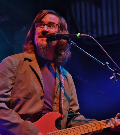 a person playing a guitar