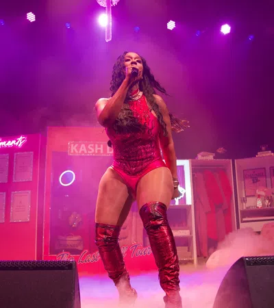 a woman singing on a stage
