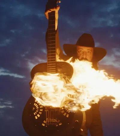 a man holding a guitar