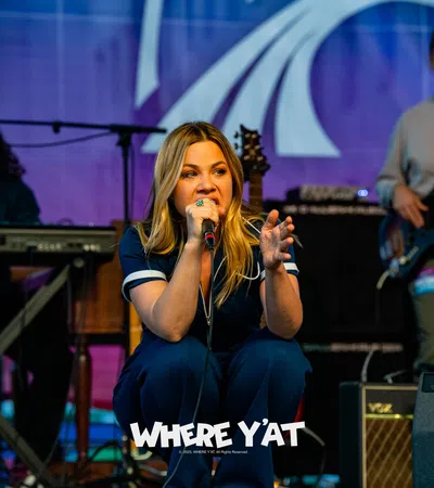 a person singing on stage
