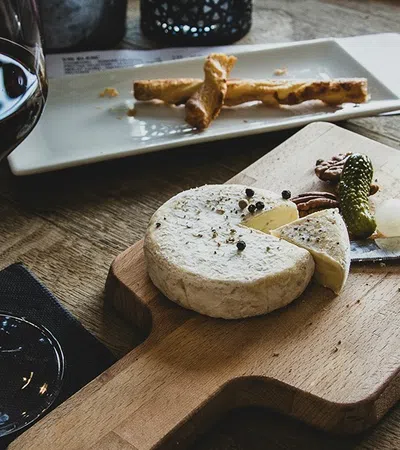 a plate of food and a glass of wine