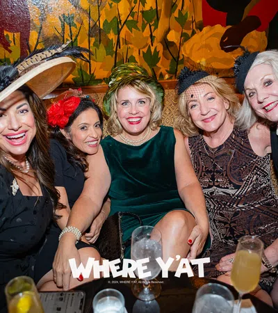 a group of women posing for a photo