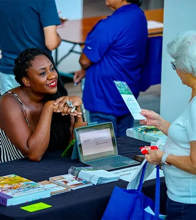 a person showing a person something on the laptop