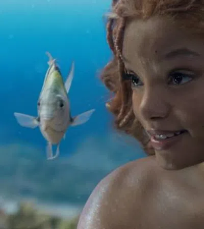 Chloe Bailey with a fish