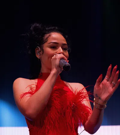 a woman singing into a microphone