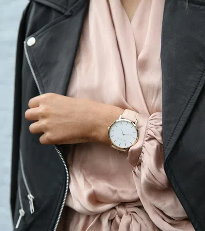 a person wearing a suit and a watch