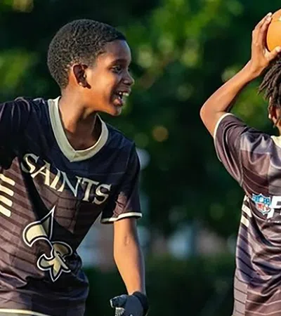 a group of people playing basketball