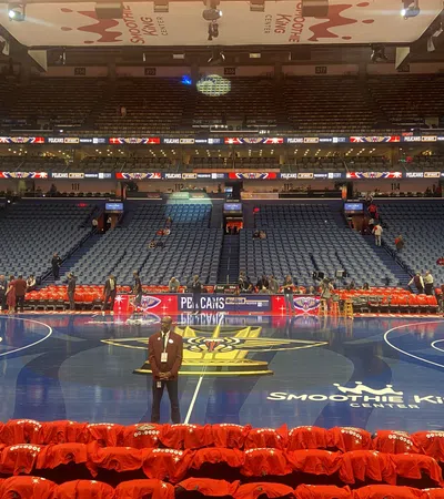 a person standing in a large empty arena