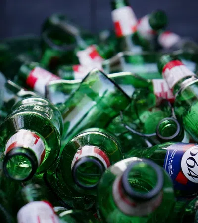 a pile of green bottles