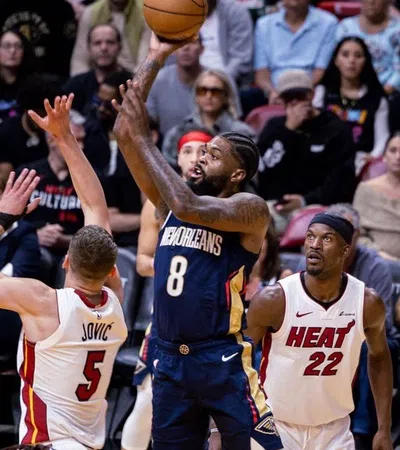 a group of men playing basketball