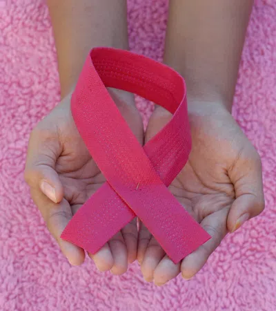 a person holding a heart shaped object