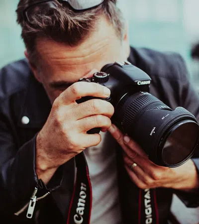 a man holding a camera