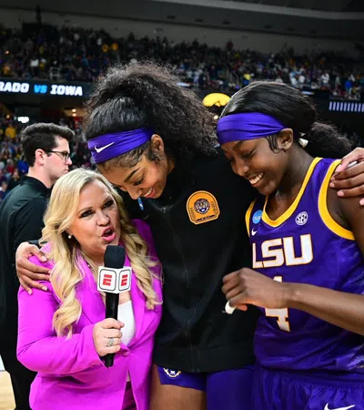 Holly Rowe et al. in a stadium