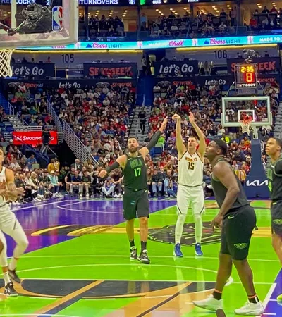a group of people playing basketball in a stadium