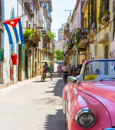 a pink car parked on a street