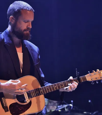 a man playing a guitar