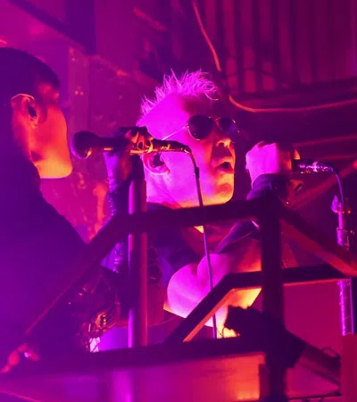 a couple of men playing musical instruments
