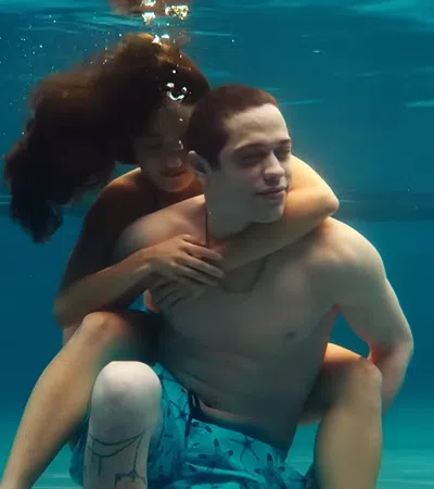 Pete Davidson and woman hugging