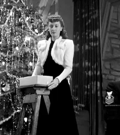 Dennis Morgan standing at a podium