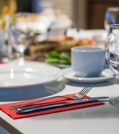 a table with plates and glasses