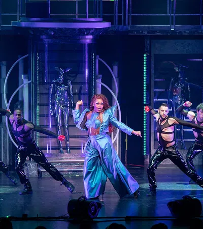 a group of people dancing on a stage