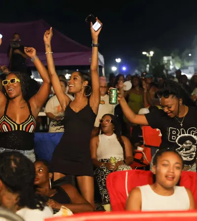 a group of people holding up their hands