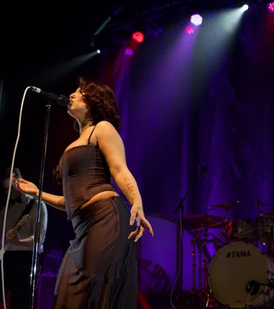 a person singing into a microphone