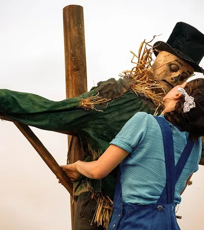 a man and woman holding a cross