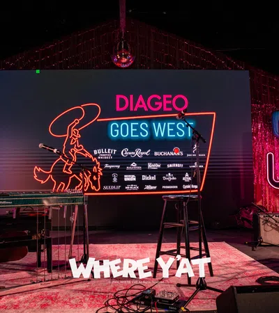 a stage with a sign and lights