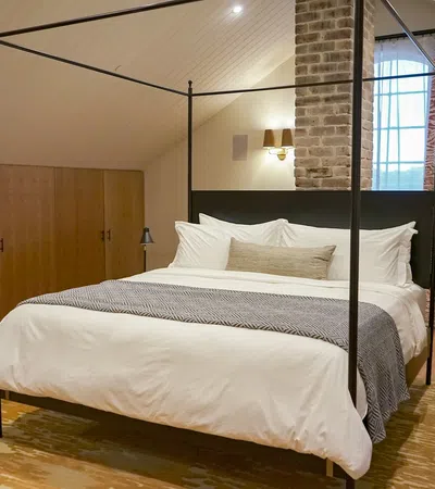 a bed with a large mirror