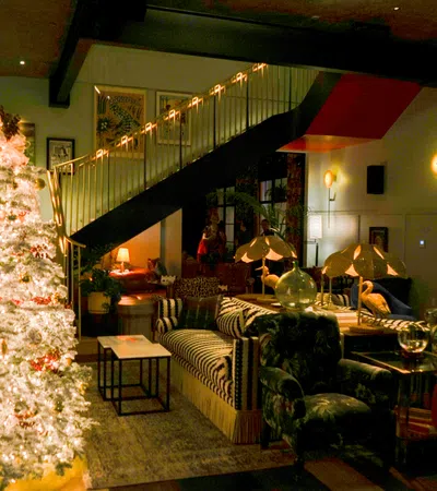 a living room with a christmas tree